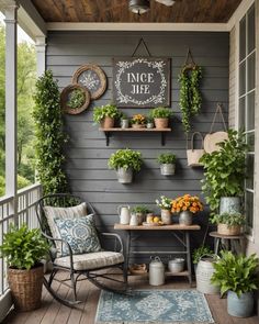 a porch with potted plants on the wall