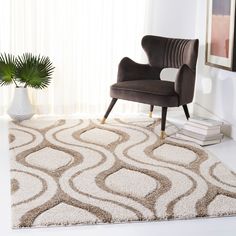 a chair sitting on top of a rug in a living room