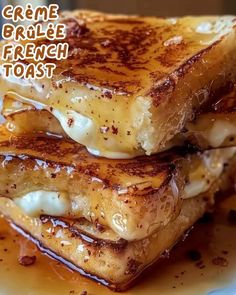 grilled french toast on a white plate topped with melted cheese and syrup, ready to be eaten