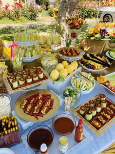 a table filled with lots of food and desserts