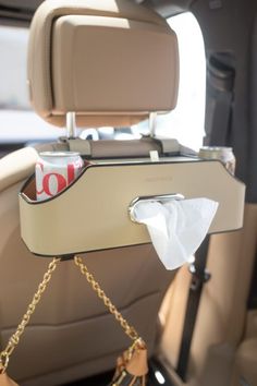 the back seat of a car with a purse hanging from it