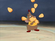 an animated character juggling oranges into the air