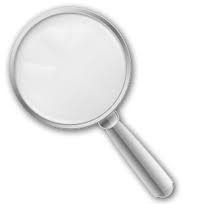 a magnifying glass on a white background with clippings to the side