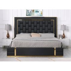 a black and gold bed with two nightstands next to it in a white room