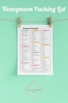 the honeymoon packing list hanging on a clothes line