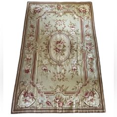 an antique rug with flowers and leaves on the bottom, is shown in white background