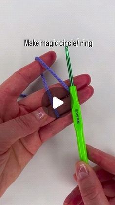 two hands are holding a green toothbrush with blue string attached to the end and one hand is holding an electric toothbrush