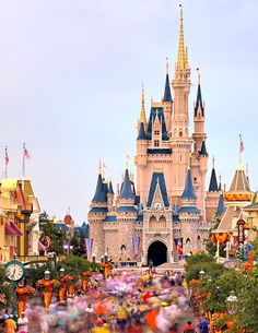 people are walking around in front of the castle