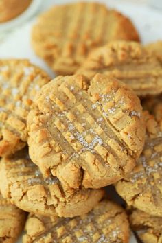 peanut butter cookies stacked on top of each other with powdered sugar in the middle