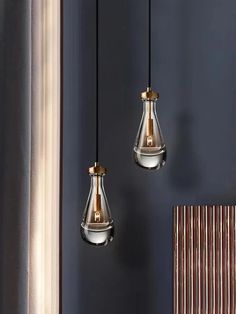 two light fixtures hanging from the ceiling in a room