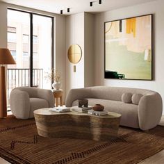 a living room with two couches and a coffee table in front of large windows