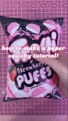 someone is holding up a bag of pink gummy bears with the words how to make a paper squishy pillow