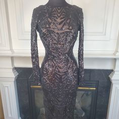 a dress on display in front of a fireplace