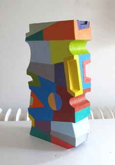 a colorful sculpture sitting on top of a white table