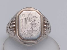 Beautiful antique signet ring made of 800 silver With curved initials Ring shoulders florally designed initials M.E Size 25 Ring head 1.3cm x 1.5cm material 800 silver A beautiful antique piece of jewelry Silver Antique Signet Ring, Vintage Engraved Antique Silver Signet Ring, Vintage Silver Signet Ring For Gift, Symbolic Antique Silver Signet Ring, Vintage Antique Silver Signet Ring Gift, Silver Signet Ring, Initial Ring, Men's Ring, Vintage Ring