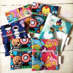 several small wallets with cartoon characters on them