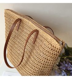 IN STOCK FAST SHIPPING FROM LOS ANGELES The Elena Handbags Straw Woven Tote is a luxurious summer staple crafted out of woven straw and reinforced with leather straps. With its spacious, zippered interior, this bag is the perfect accessory for day trips and evening events alike, offering effortless elegance wherever you go. Size: 30cm wide x 33cm tall (12in x 13in) Designer Style ID: 8322 Large Straw Woven Tote Bag with Leather Straps, Summer Bag, Everyday Shoulder Bag, Beach Bag Everyday Shoulder Bag, Crochet Shoulder Bags, Summer Purses, Summer Tote Bags, Summer Handbags, Straw Tote Bag, Woven Handbags, Straw Handbags, Genuine Leather Totes