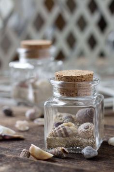 sea shells and sand in a glass jar