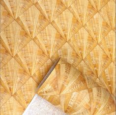 an overhead view of a wooden floor with a tile design on the top and bottom