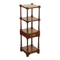 three tiered wooden shelf with drawers on each side and one drawer at the top