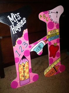 the letter h is made out of cardboard and decorated with school supplies, such as scissors