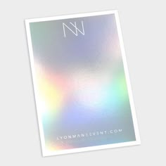 a white and silver foiled card with the letter n on it's front