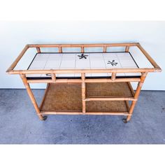 a bamboo and glass coffee table on wheels