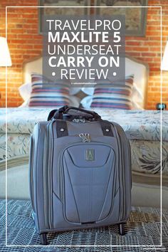 a suitcase sitting on the floor in front of a bed with a brick wall behind it and text overlay that reads travelpro maxlite 5 under seat carry on review