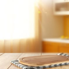 a wooden cutting board sitting on top of a table