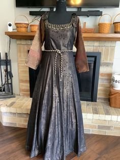 "This is a designer Renaissance in gorgeous chocolate and copper damask.  Zips up side.  Built in crinoline.  Sleeves are shades of brown and tie at top with grommet.  Neckline has amazing bronze chains and coins.  Waist has a cord tie with dangling coins. Chest 40\", waist 36\", length 60\". You will never see another like this." Bronze Medieval Dress, Macbeth Costumes, Asoiaf Fashion, Historic Dresses, Game Of Thrones Dress, Historical Outfits, Fair Outfit, Medieval Dresses, Medieval Era