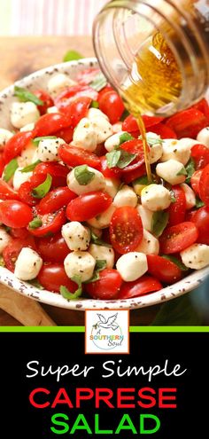 a salad with tomatoes and mozzarella cheese being drizzled over it