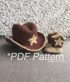 two crocheted hats sitting next to each other on the ground near a wall