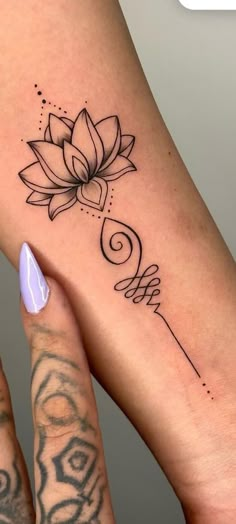 a woman's foot with a tattoo on it and a flower in the middle