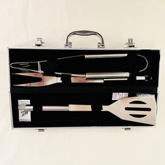 an open suitcase with utensils in it