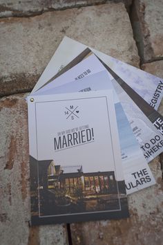 a pile of paper sitting on top of a stone floor next to a brick wall