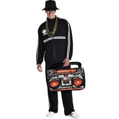 a man in a black outfit is holding a boombox