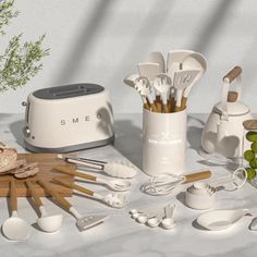 an assortment of kitchen utensils on a table