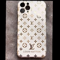 the louis vuitton phone case is laying on top of a piece of cloth