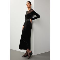 Black mesh and velvet (90% Polyester, 10% Spandex). Sheath. Long sleeves. Crewneck. Pull on. 54" from shoulder to hemline. Imported. Elegant Sheer Bodycon Dress For Formal Occasions, Elegant Evening Bodycon Dress With Sheer Back, Fitted Sheer Mesh Evening Dress, Evening Bodycon Mesh Dress With Sheer Back, Chic Stretch Mesh Dress For Evening, Elegant Black Stretch Mesh Dress, Elegant Sheer Bodycon Dress For Evening, Elegant Bodycon Dress With Sheer Back For Night Out, Sleek Fitted Dress With Sheer Sleeves