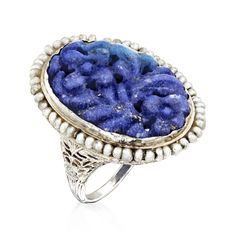 Ross-Simons - C. 1970 Vintage Carved Lapis, Seed Pearl Ring in 18kt White Gold. Size 6. C. 1970. With an incredibly regal presence, this Estate collection ring is sure to bring your style to the helm of conversation. Intricately carved to reveal a cluster of flowers and leaves, the 23x15mm oval lapis is showcased inside a luminous frame of shiny seed pearls. Finely set in polished 18kt white gold. 1 1/8". White pearl and carved lapis ring. Exclusive, one-of-a-kind Estate Jewelry. Seed Pearl Ring, Vintage Silver Jewelry, Lapis Ring, Seed Pearl, Flowers And Leaves, Pearl Ring, White Pearl, Estate Jewelry, Pearl White