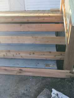 some steps made out of wood and concrete