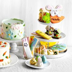 there are many different cakes and desserts on the plates in front of each other