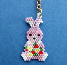 a beaded key chain with a pink bunny on it