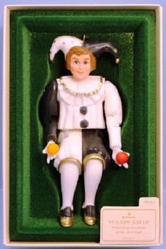 a toy figurine in a green box