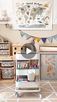 a child's playroom with toys and storage bins on the floor in front of a world map