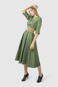 Influenced by the endless expanse of forest and the mind clouded by color green, this fit and flare dress is tailored in a beautiful green tone.   Fabric: Shell: 100% wool, hand weaved in India Lining: 100% cotton Green Silk A-line Midi Dress, Green Flared Skirt Dress For Spring, Green Silk Dress With Pleated Bodice, Green Fitted A-line Pleated Dress, Green Pleated Back Dress For Spring, Spring Green Dress With Pleated Back, Green A-line Pleated Midi Dress, Green A-line Midi Dress With Pleats, Elegant Green Midi Dress With Pleated Waist