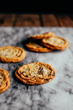 several cookies sitting on top of a marble counter