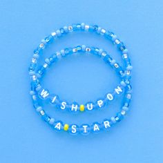 Wish Upon A Star bracelet set in Blue Fairy bead colors! Handmade with love using Czech glass beads, blue and white letter beads and stretch cord. Get creative! All my bracelets are meant to be mixed, matched & stacked!  SIZING: Measure your wrist around the widest point and add .25-.5 inches to get the most comfortable or desired fit. If you don't have a flexible tape measure, you can use a piece of string to wrap around your wrist and then measure the length of the string. (For example: my wrist size is 6" and I will wear a 6.5" bracelet for a snug fit and 7" for a loose fit). CARE INSTRUCTIONS: Please be careful to not overstretch bracelets too far. They are made out of a durable elastic string but are still capable of breaking if not handled carefully. Avoid submerging bracelets in wat Disney Friendship Bracelet Ideas, Disney Bracelet Ideas, Disney Beaded Bracelet, Disney Friendship Bracelet, Disney Friendship, Disney Bracelets, Fairy Bracelets, Diy Jewelry Bracelets, Disney Bracelet