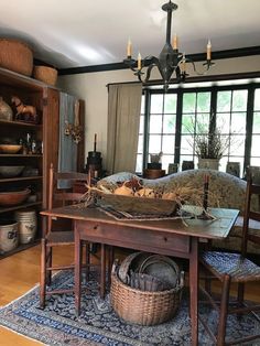 a living room filled with furniture and lots of windows