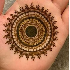 a hand with a henna design on it